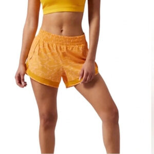 Women's Athleta Mesh Racer Run Mid Rise Short 4 Inch Inseam Size XS Yellow Print